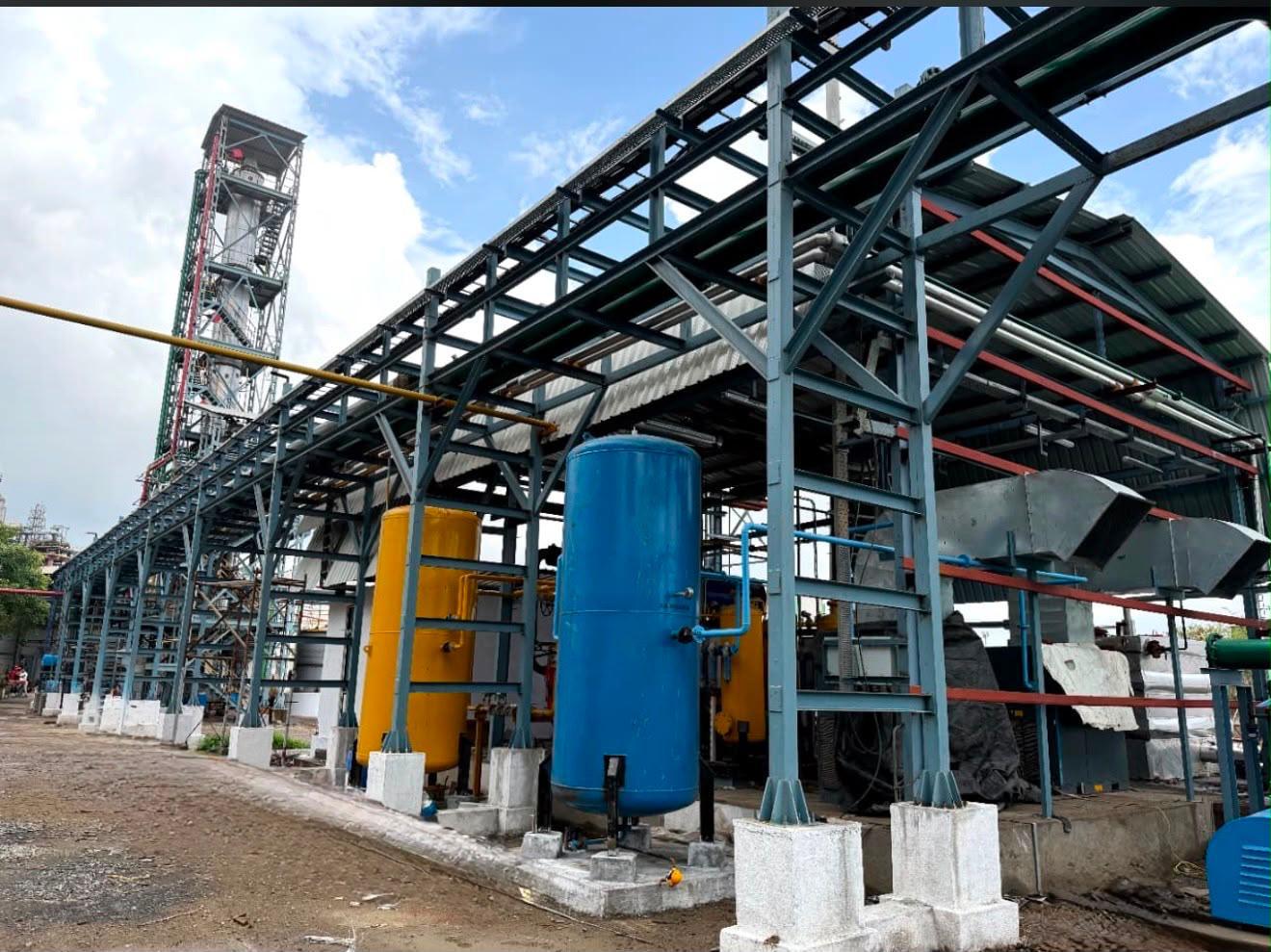 Close view of structural steel, pipelines and process vessels at the manufacturing facility
